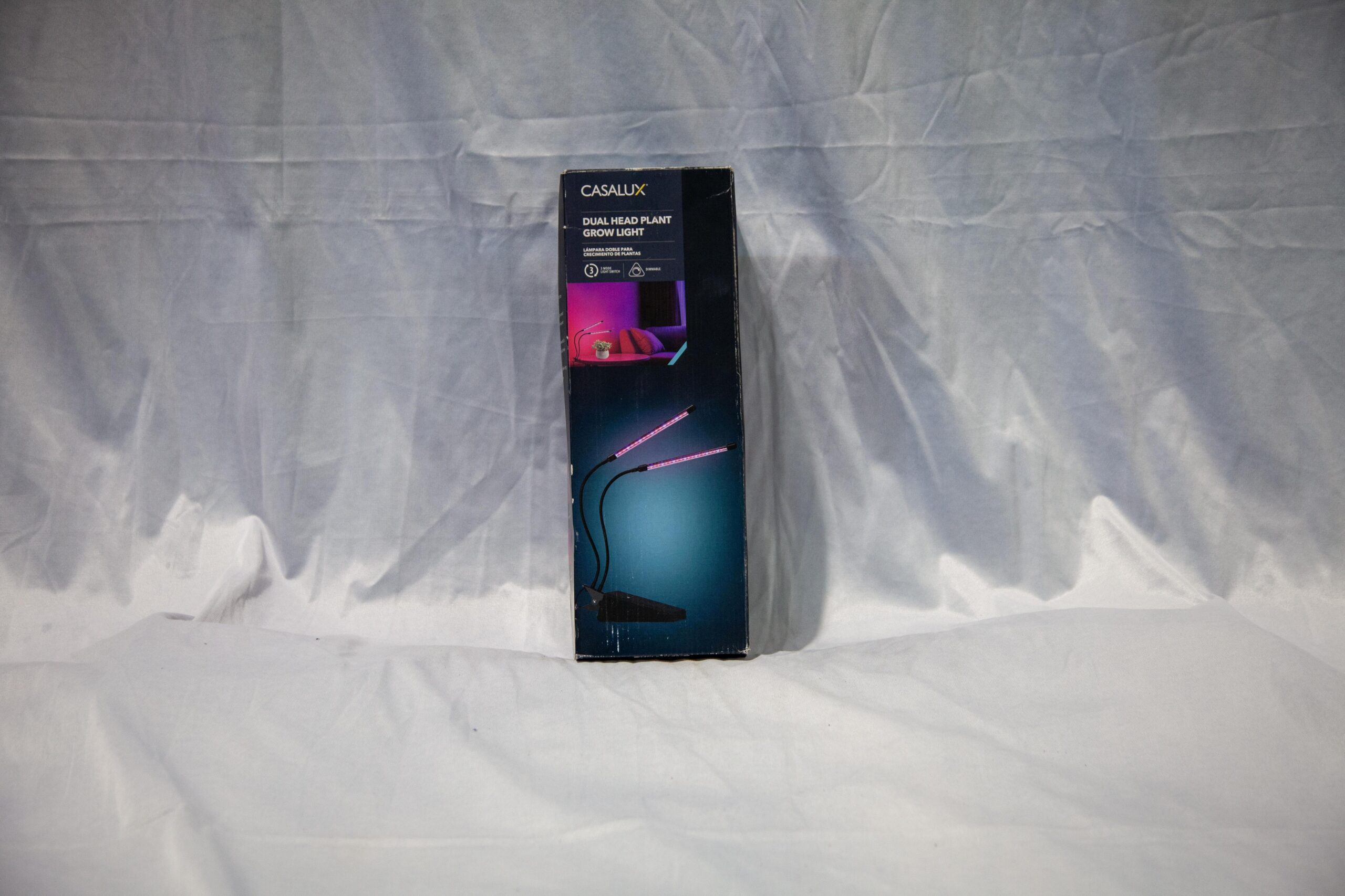 Dual-head plant grow light by Casalux, designed for optimal indoor plant growth with adjustable arms and LED technology. The packaging features modern design elements. Ideal for cultivating a variety of plants indoors.