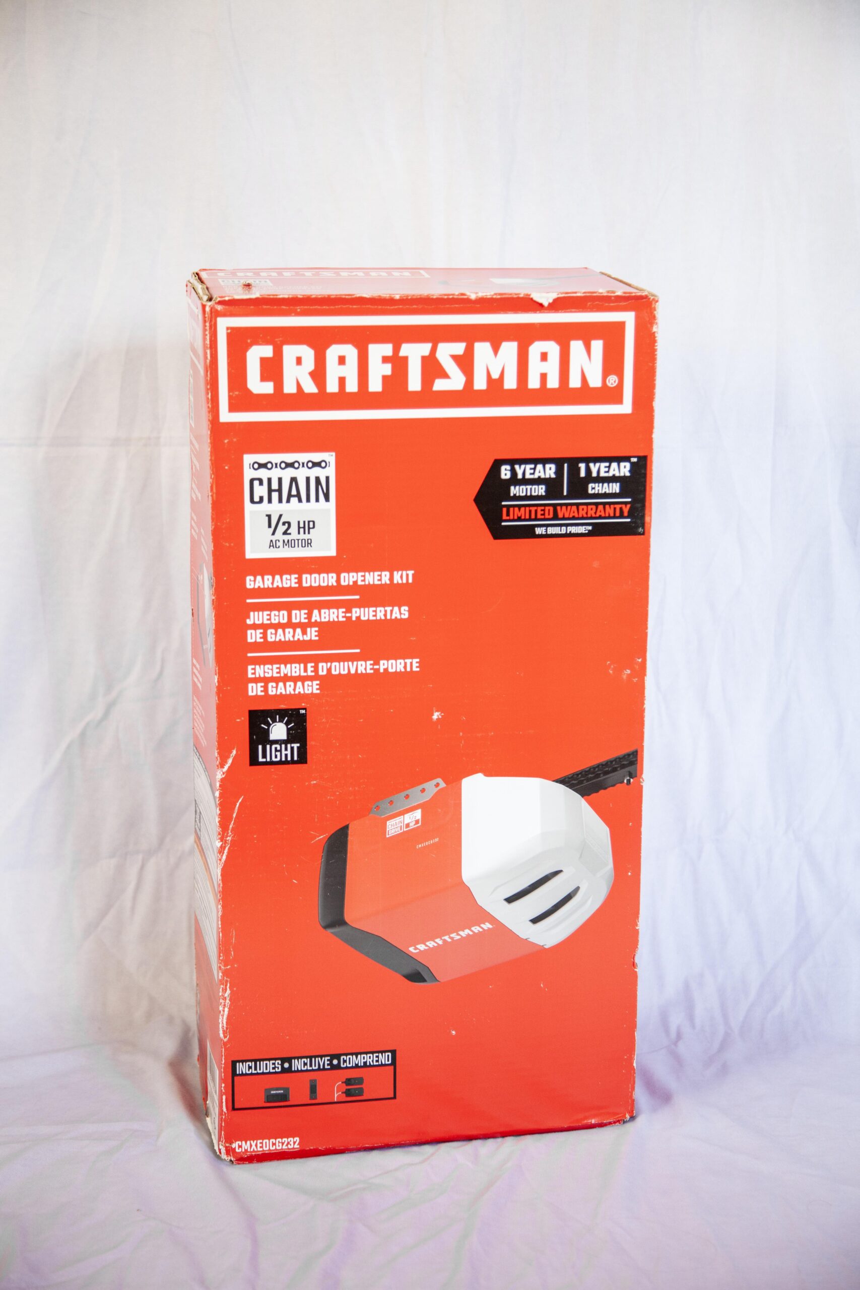Craftsman garage door opener kit with 1/2 HP AC motor, featuring a chain drive, light, and a 6-year motor and 1-year chain limited warranty.