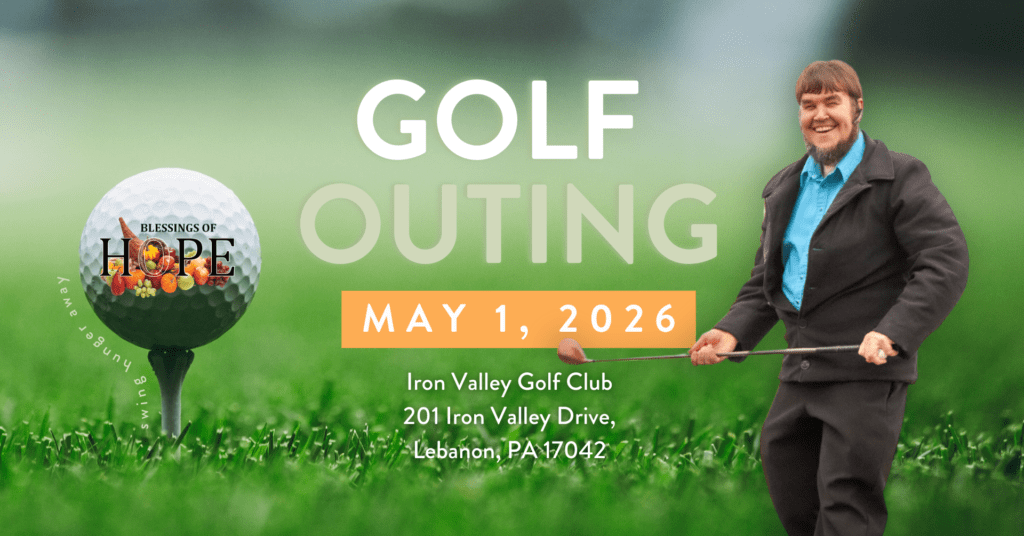 Golf outing promotional image featuring a smiling man holding a golf club, set against a vibrant green grass background. The event details include "Golf Outing" on May 1, 2026, at Iron Valley Golf Club, located at 201 Iron Valley Drive, Lebanon, PA 17042, with the logo "Blessings of Hope" displayed on a golf ball.